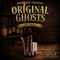 A Halloween-themed product display featuring a ghost-shaped candle holder wearing a witch hat and holding a broom and book, set on a wooden table in front of a dark bookshelf background. Large text reads 'The Original Collection Original Ghosts' with 'Corvin Ashwood' and 'Matlock Ghost Emporium' visible.